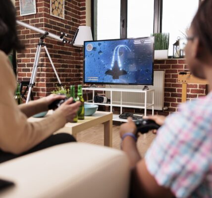 diverse-close-friends-in-living-room-sitting-on-so-2023-11-27-05-22-51-utc