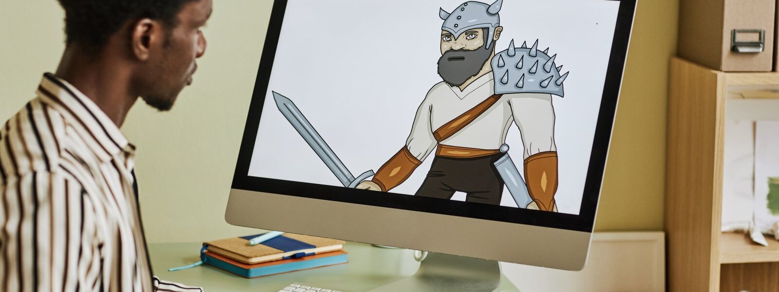 Między słowem a obrazem – jak tworzyć powieści graficzne 1 mężczyzna tworzący komiks